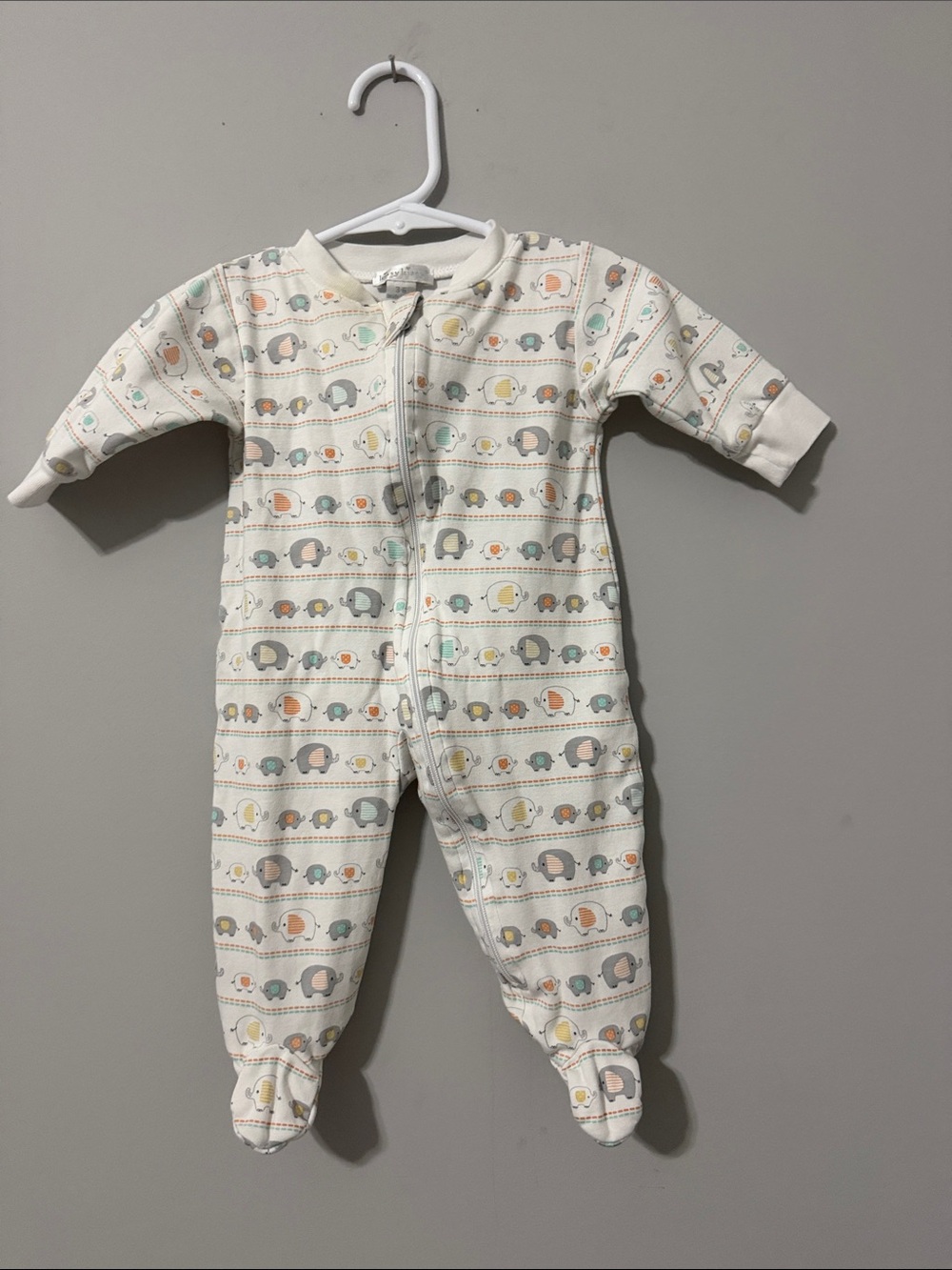 Kissy Kissy Cream Footed One-Piece with Pastel Elephant Print-Size 3-6 months.